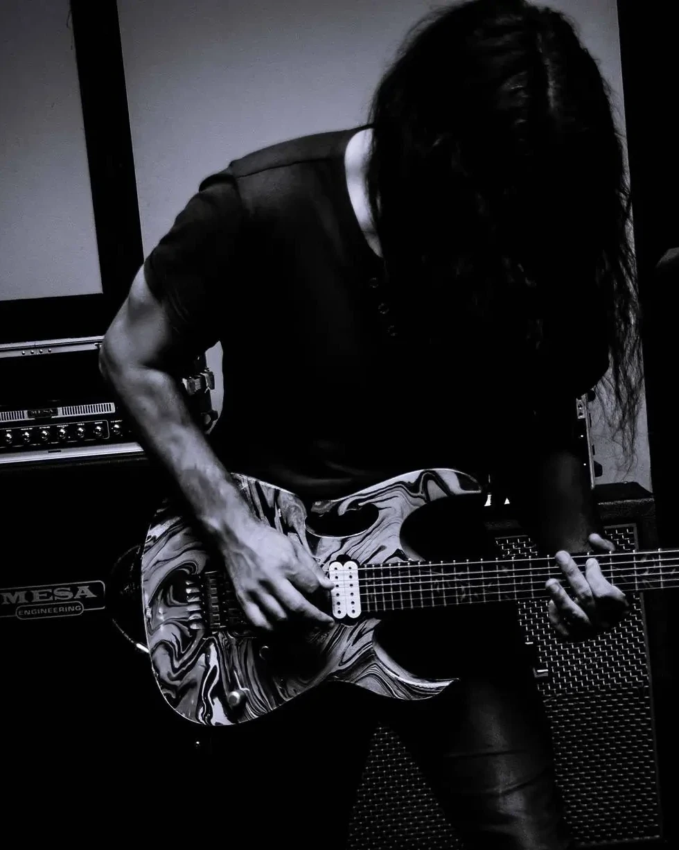 Rob performing live with his guitar